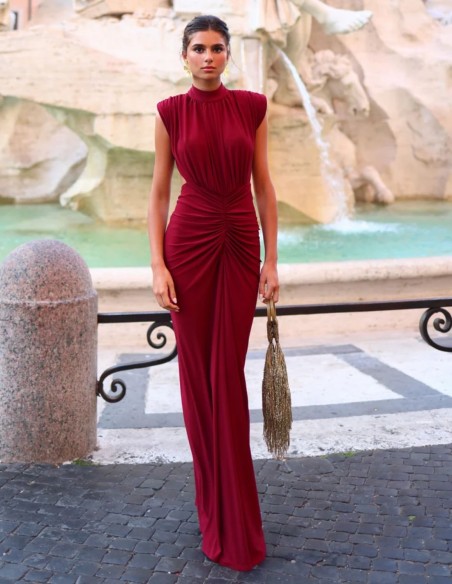 Maxi-length dress with a high neckline and shoulder pads