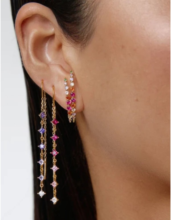 Long gold earrings with purple cubic zirconia stones