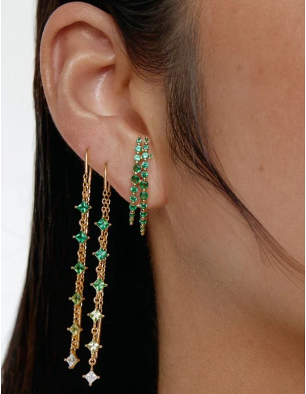 Long gold earrings with green cubic zirconia stones
