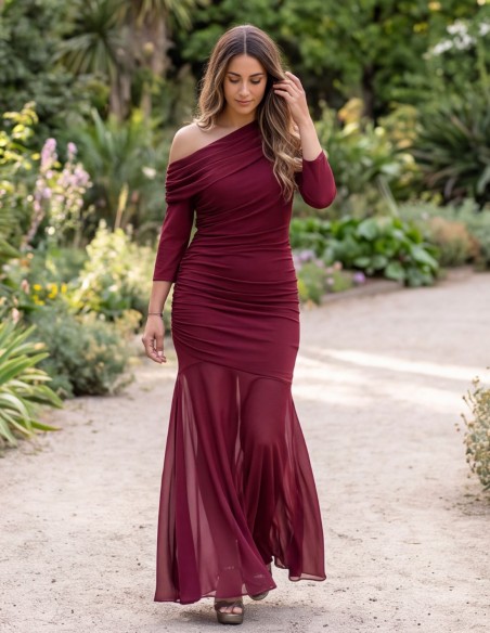 Long burgundy dress with long sleeves and an asymmetrical neckline