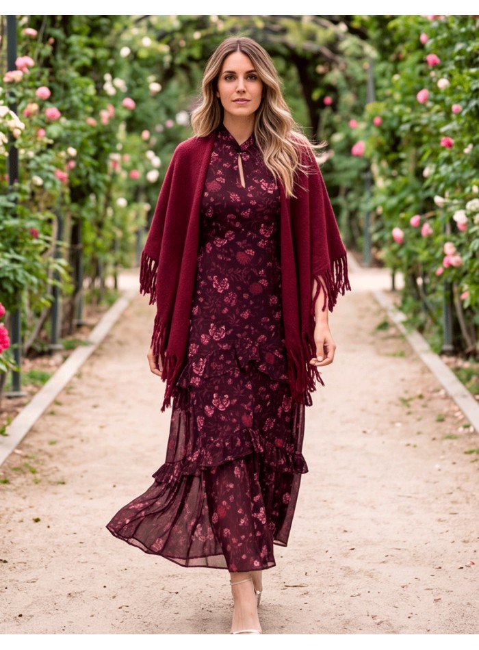 A maroon fringed poncho, crafted from a soft, enveloping fabric