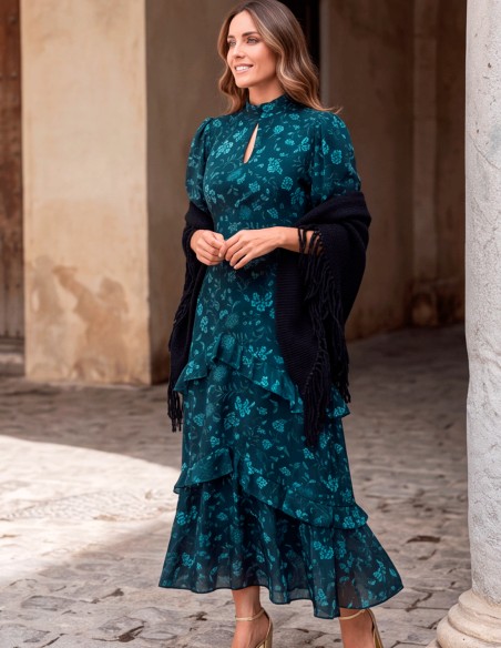 Navy blue fringed poncho, crafted from a soft, enveloping fabric