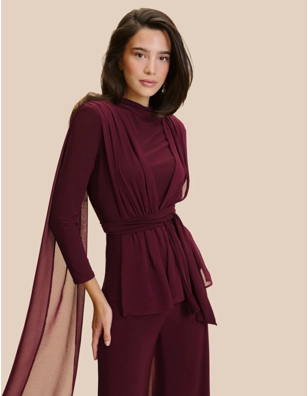 Blouse à manches longues, col fermé et ceinture