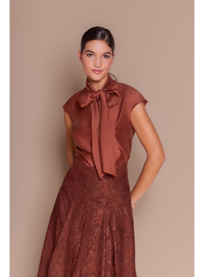 Brown blouse with a bow at the neck
