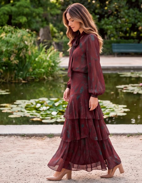 Maroon outfit with a ruffled skirt and a blouse with a bow