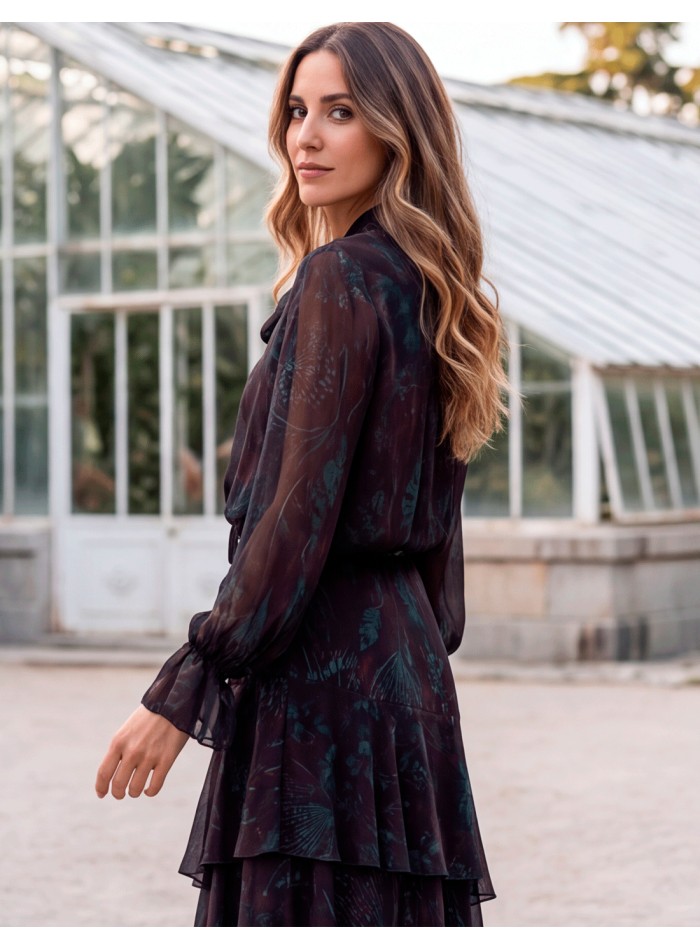Aubergine-colored set with a tie-front blouse and a ruffled skirt