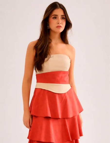 Long strapless dress with detailing at the waist and a layered ruffled skirt