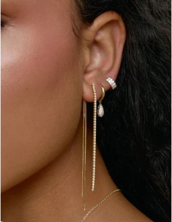 White cubic zirconia earrings with a gold chain 2