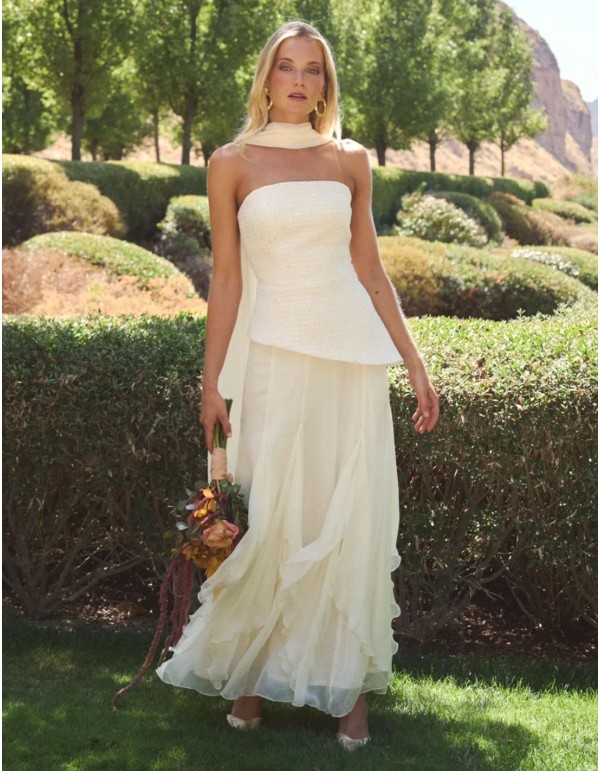 Off-white strapless bridal top with an asymmetrical cut