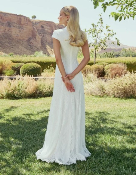 Long white lace wedding dress with a mandarin collar