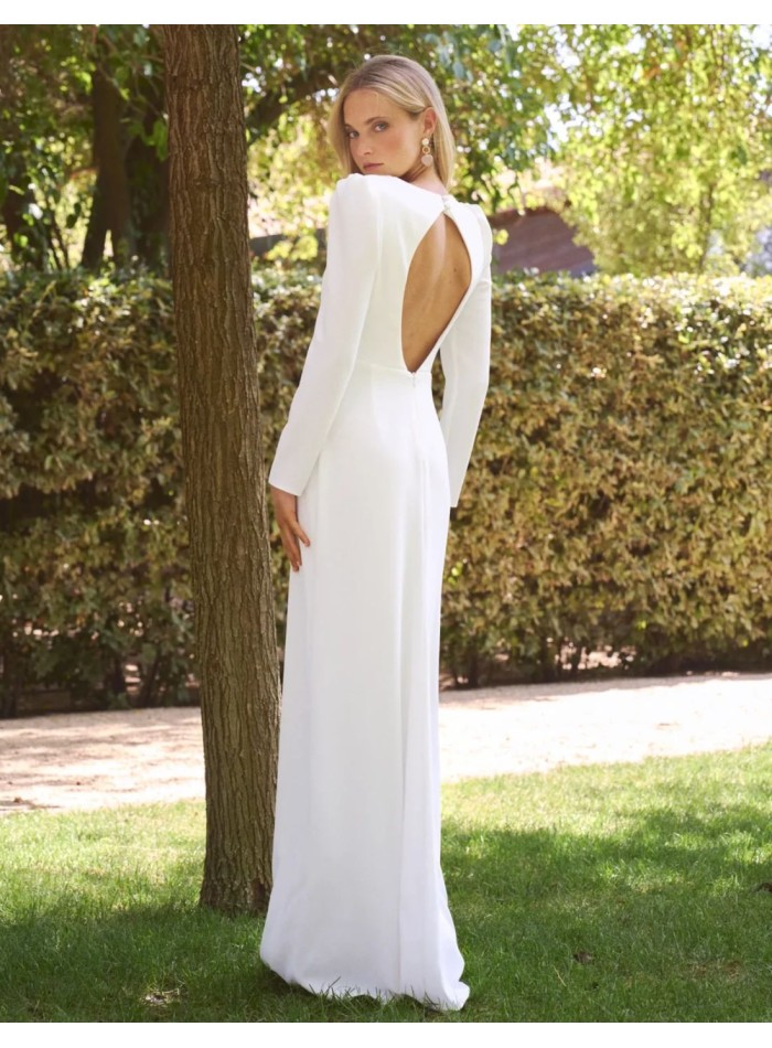 Long crepe wedding dress with a V-neckline and...