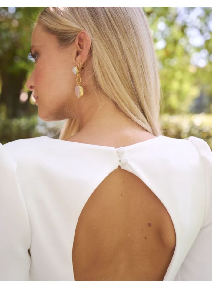 Long crepe wedding dress with a V-neckline and...