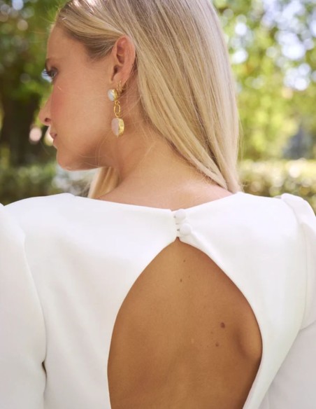 Long crepe wedding dress with a V-neckline and long sleeves