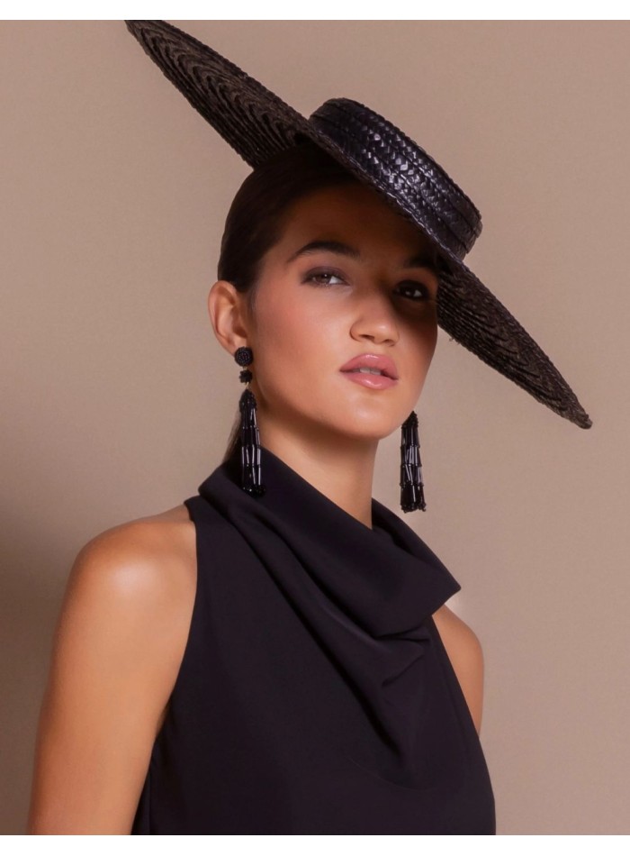 Raffia headpiece with an asymmetrical brim and...