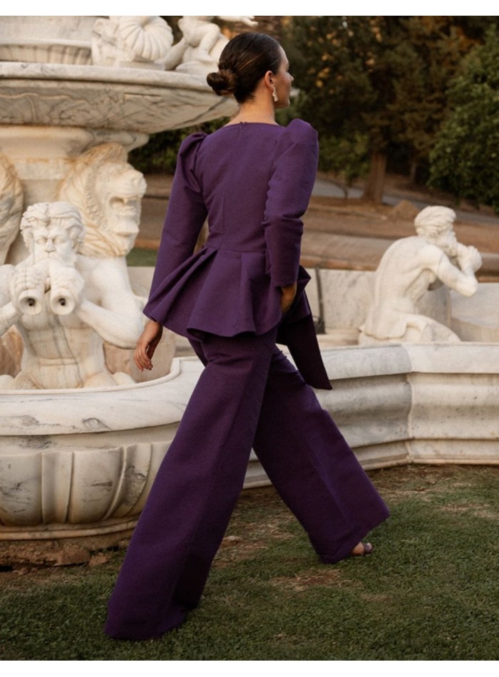Purple peplum top with a square neckline and a...