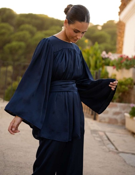 Navy blue loose-fitting long-sleeved blouse with a belt