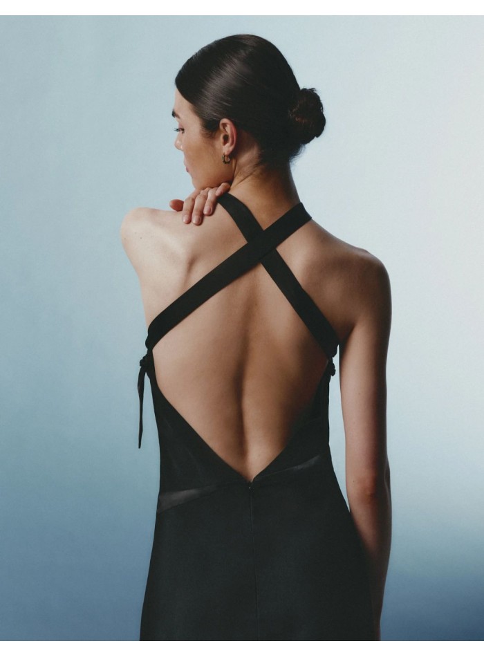 Long black crepe dress with a halter neckline...