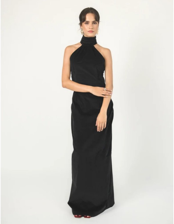 Long black velvet dress with a halter neckline and an...