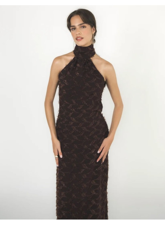 Long brown dress with a halter neckline and an...