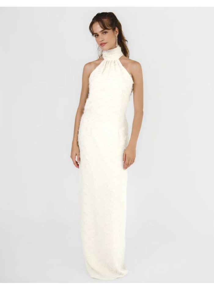 Long cream-colored dress with a halter neckline...