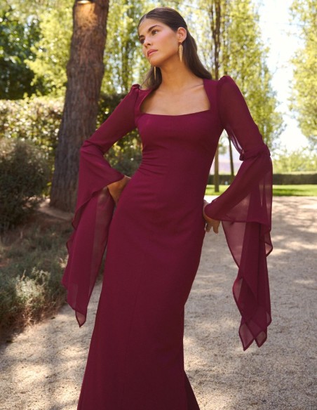 Long maroon dress with a straight neckline and flowing chiffon sleeves
