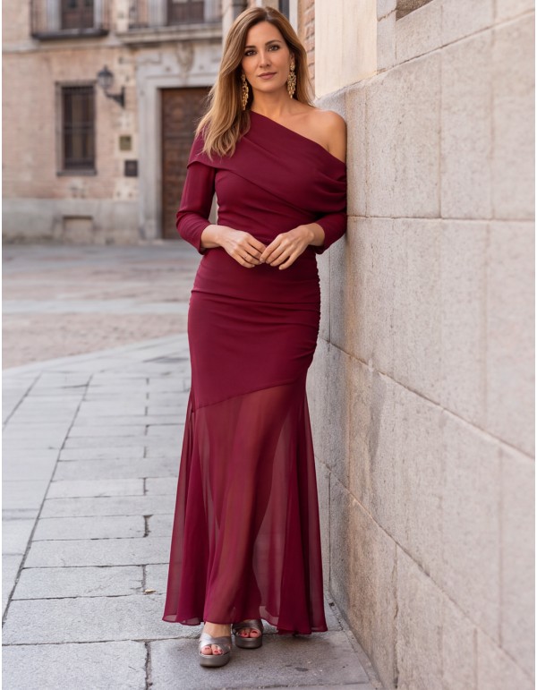 A burgundy long wedding guest dress with an asymmetrical neckline 2