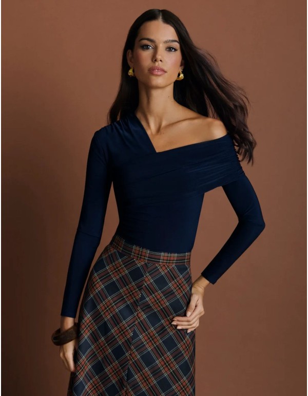Navy blue silk-knit top with an asymmetrical neckline and draping