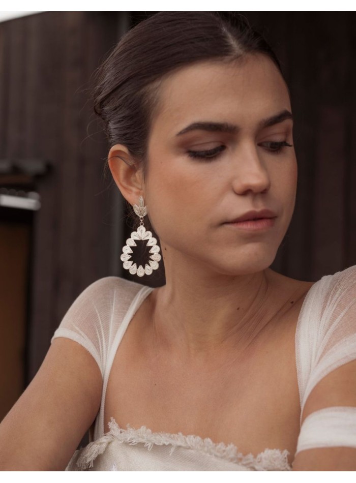 Openwork earrings with a teardrop design and...