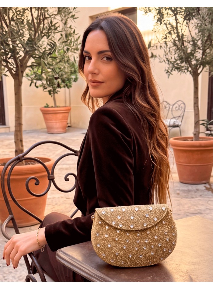 gold structured evening bag with rhinestones and small mirror-effect crystals