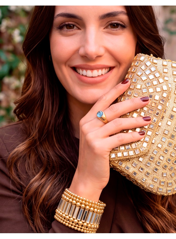 Rigid gold clutch with square crystals and a geometric design