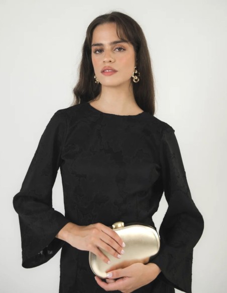Long fitted black dress in sheer brocade fabric with a side slit.