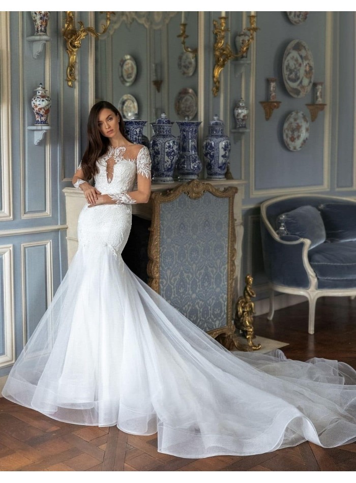 Vestido de novia con manga efecto tatuaje bordado y cola voluminosa