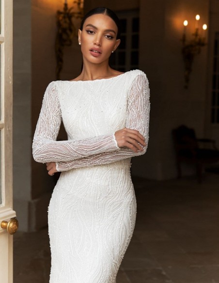 Wedding dress with long sleeves in mermaid cut with rhinestone embroidery at INVITADISIMA Wedding dress with long sleeves in mermaid cut with rhinestone embroidery at INVITADISIMA