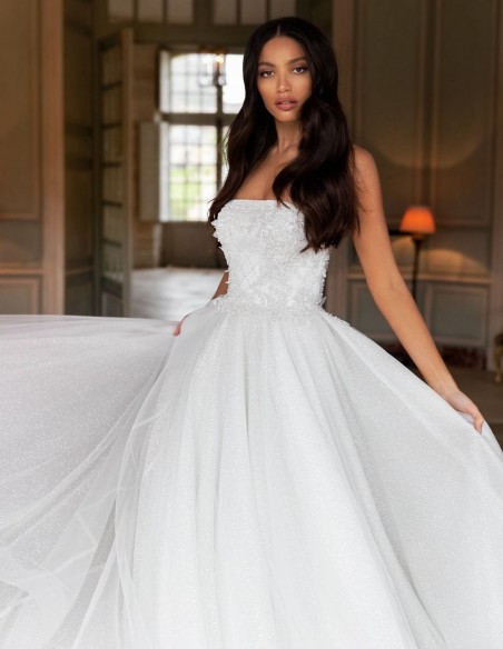 Wedding dress with strapless neckline and princess cut at INVITADISIMA Wedding dress with strapless neckline and princess cut at INVITADISIMA