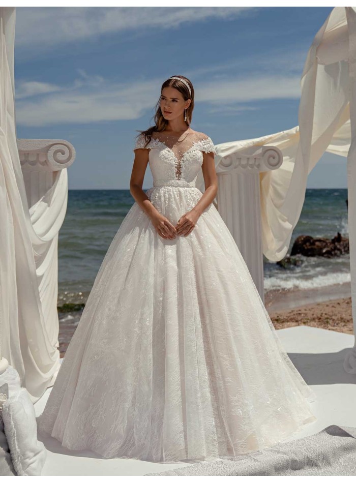 Princess cut wedding dress with boat neckline and long sleeves with transparent back by ANNIE VICTOR at INVITADISIMA
