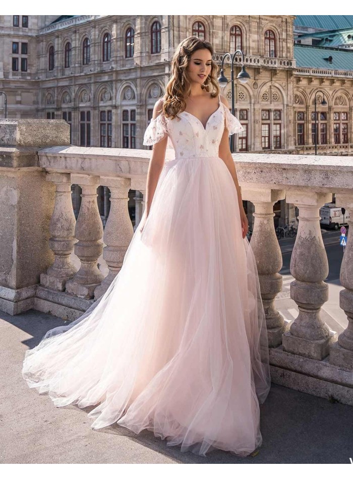 Wedding dress with embroidered bodice and tulle skirt