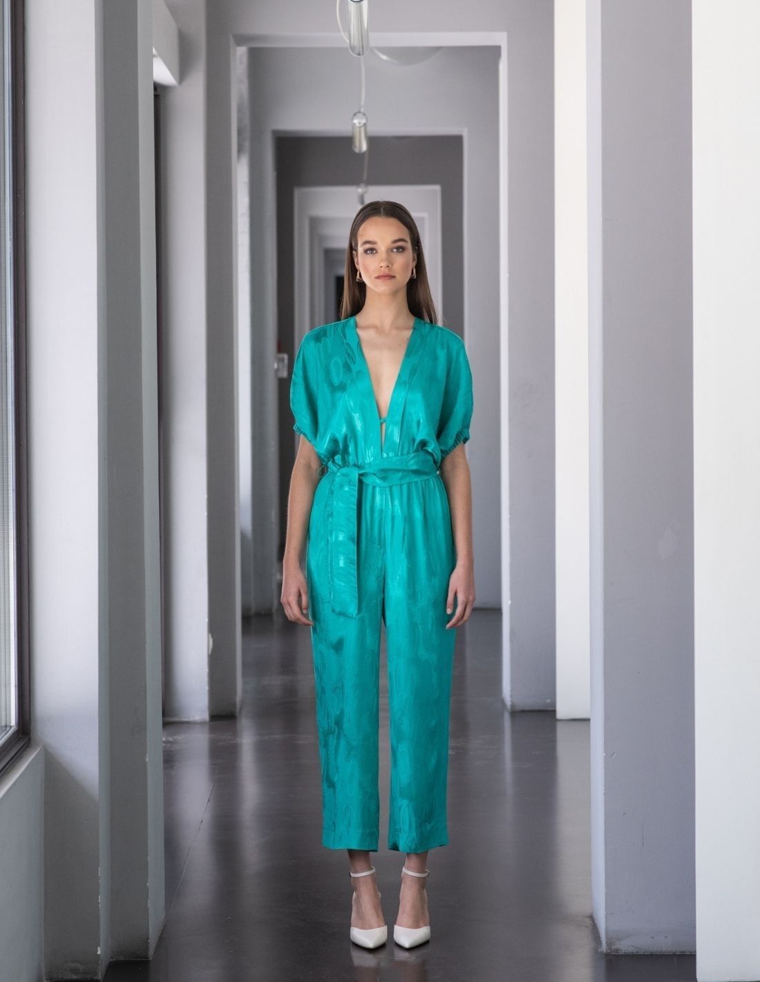 Turquoise jumpsuit with jacquard print | INVITADISIMA