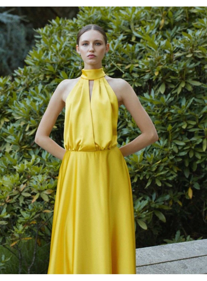 Long yellow dress with halter neckline and spaghetti straps