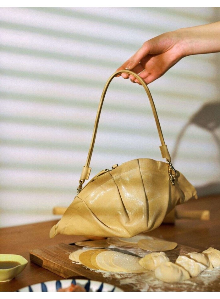Beige gyoza handbag with leather handle