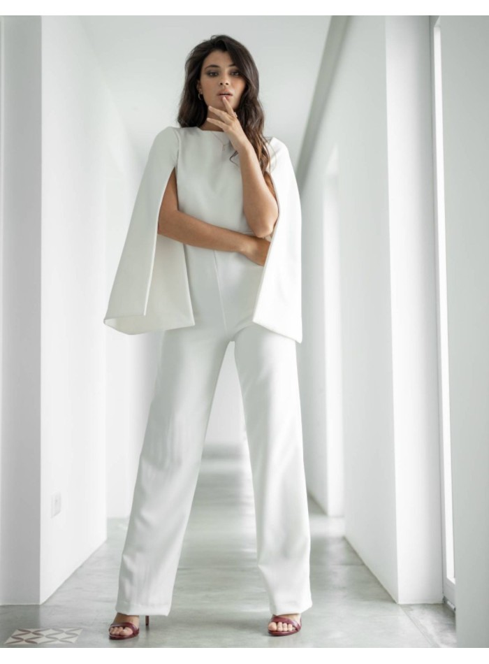 Long white party jumpsuit with long caped sleeves for brides