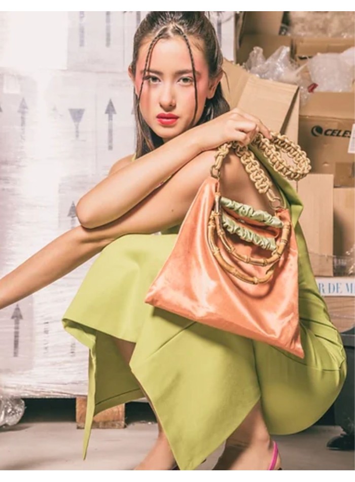 Orange satin handbag with braided handle and natural bamboo handle