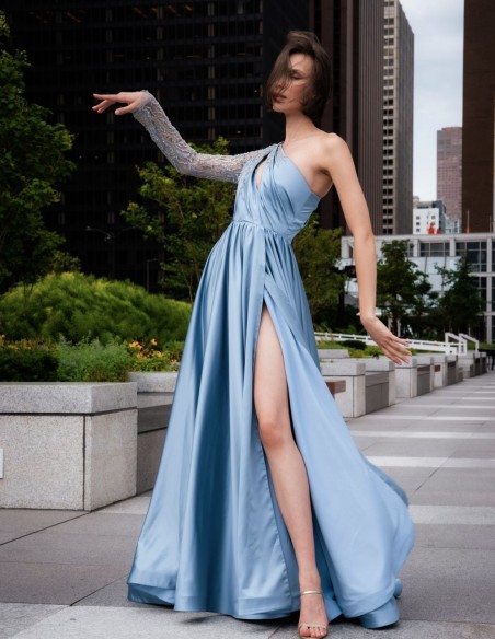 Long party dress with asymmetrical neckline and sleeves with rhinestones and transparencies. Long party dress with asymmetrical neckline and sleeves with rhinestones and transparencies.