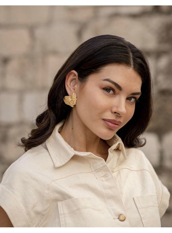Gold party earrings with relief