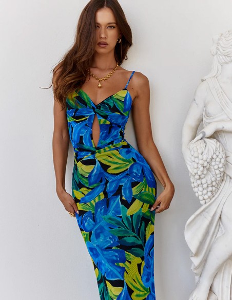 Long party dress with floral print, thin shoulder straps and open back for guests Long party dress with floral print, thin shoulder straps and open back for guests