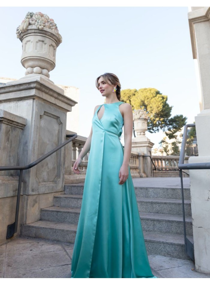 Long blue satin party dress with opening in the chest and back and knotted at the waist.