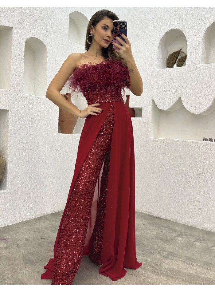 Evening jumpsuit with feather neckline made of sequins and cape skirt