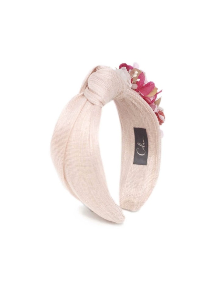 Bandeau rose noué avec des fleurs préservées