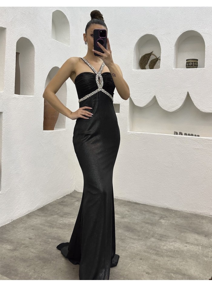 Long evening dress with strapless neckline and rhinestones at the neckline