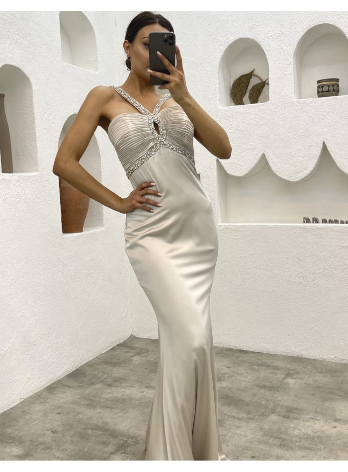 Long evening dress with strapless neckline and rhinestones at the neckline