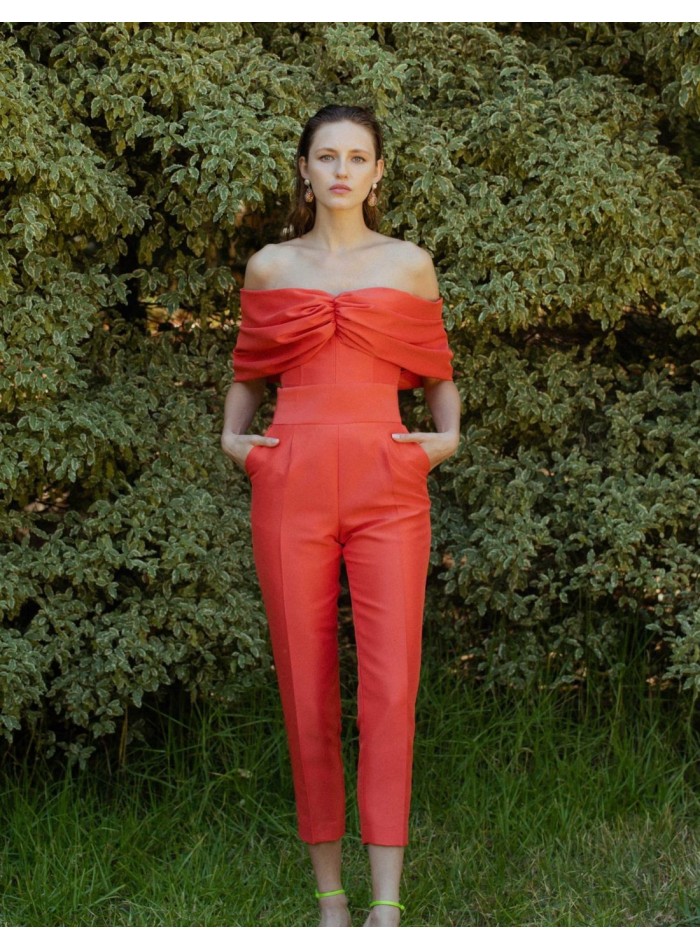 High-waist long pants with orange structured fabric.